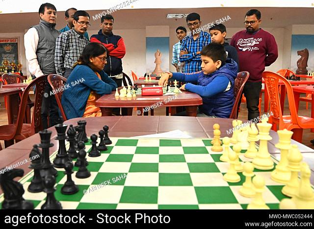 Shikha Das Gupta, a 65-year-old lady plays chess during a state level BLITZ CHESS CONTEST at the state chess coaching centre hall at Agartala