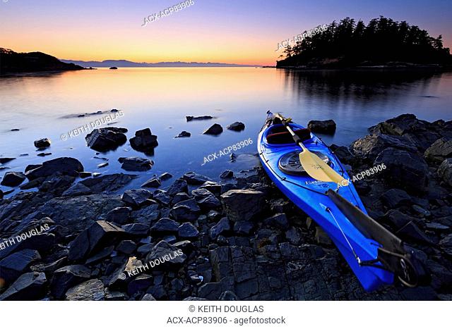 Sea kayak scene at sunrise, Pipers Lagoon Park, Nanaimo, Vancouver Island, British Columbia