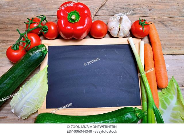 Board fresh vegetables on wooden board