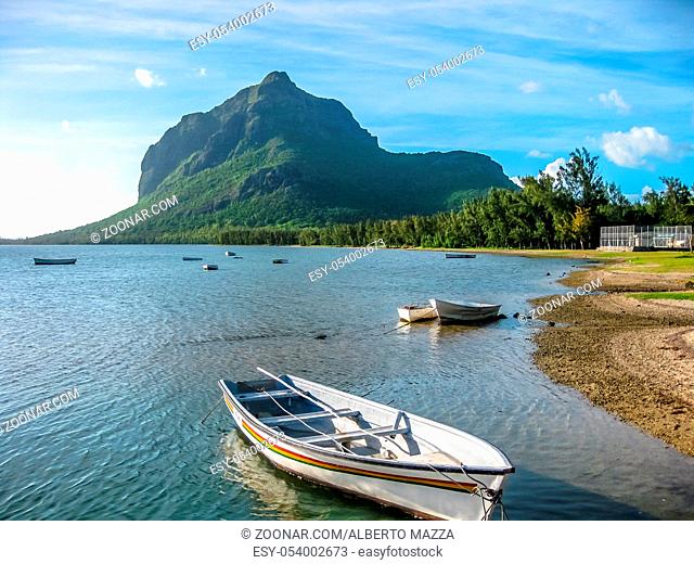 The beautiful beach of Le Morne Brabant with its boats, famous for kite surfing. The peninsula is dominated by a mountain of basalt rock and is Unesco Heritage