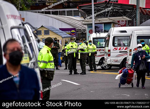 Colombia's police guard protests as drivers of public service vehicles hold protest on the Rumichaca International bridge that conects the countries of Colombia...