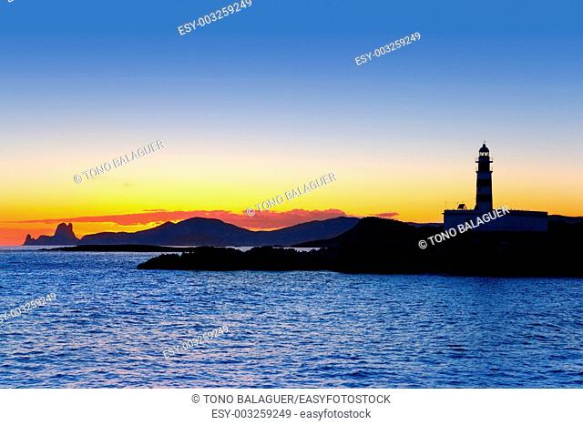 Ibiza island sunset lighthouse and Es Vedra in background