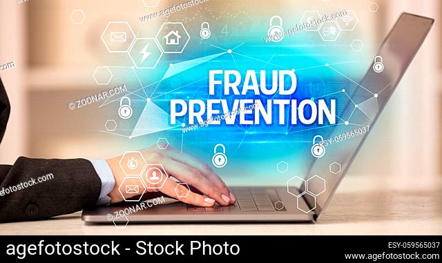 FRAUD PREVENTION inscription on laptop, internet security and data protection concept, blockchain and cybersecurity