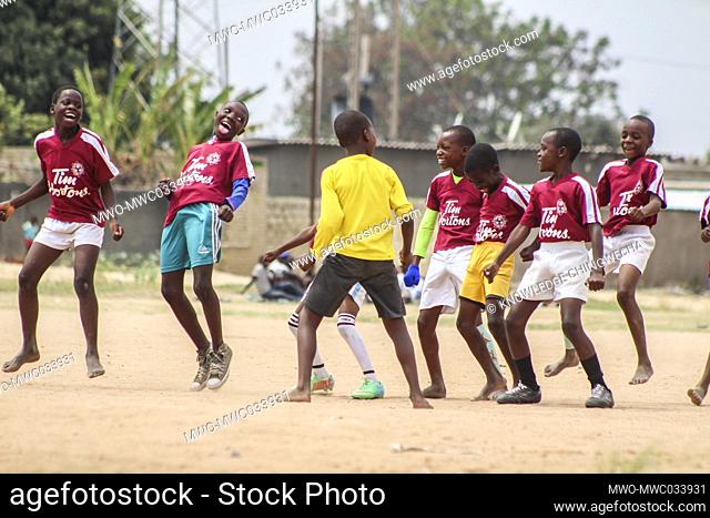 Junior academy players celebrate a goal during an u12 soccer tournament in Chitungwiza, Zimbabwe. The country readies for opening of the rest of the grades in...