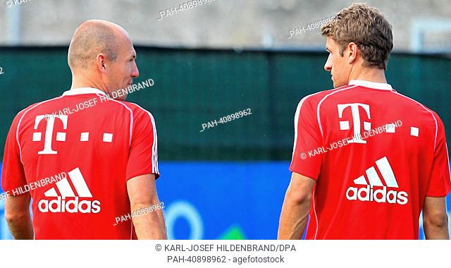 Bayern's Arjen Robben (L) and Thomas Mueller train in Arco, Italy, 06 July 2013. From 04 to 12 July 2013 the Bundesliga team prepares for season 2013-14 in a...