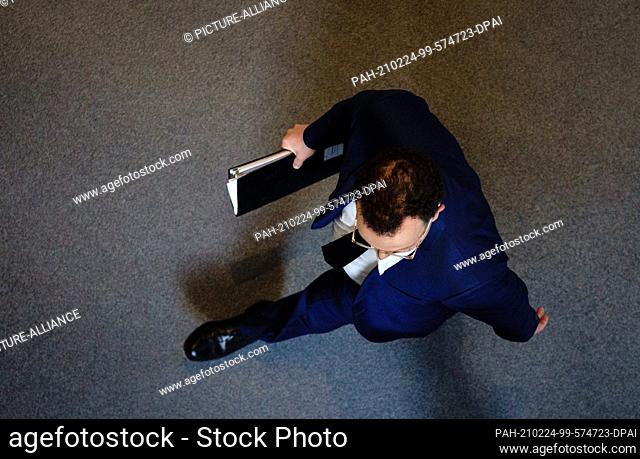 24 February 2021, Berlin: Jens Spahn (CDU), Federal Minister of Health, leaves the Bundestag after questioning the federal government