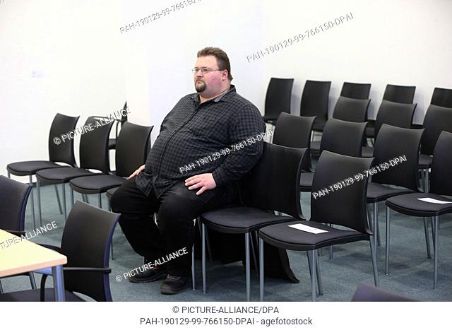 29 January 2019, Rhineland-Palatinate, Koblenz: NPD official Safet Babic sits in a visitor's seat in the negotiation hall of the Constitutional Court of...