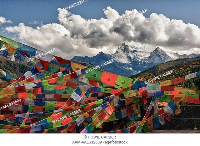 One of Three Holy Peaks of Yading Nature Reserve surrounded by Prayer Flags, Sichuan Province near Daocheng, China
