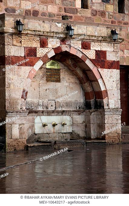 The fountain of the Three (Ucler Cesmesi) in the first courtyard of the Haji Bektash Museum in Nevsehir Turkey. It was built by Haji Feyzullah Baba who was the...