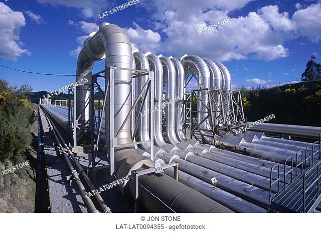Thermal activity. Geothermal power station. Steel pipes harnessing natural energy source