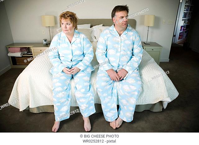 Overweight couple in matching pajamas