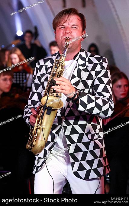 RUSSIA, MOSCOW - JULY 8, 2023: Saxophonist Taras Gusarov performs with the Imperialis Orchestra during a concert at the Arbatskaya station of the Moscow Metro...