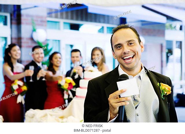 Russian man giving toast at wedding