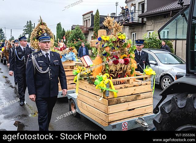 Traditional procession with straw wreath after mass during Dozynki Slavic harvest festival in Rogow village, Lodz Province of Poland