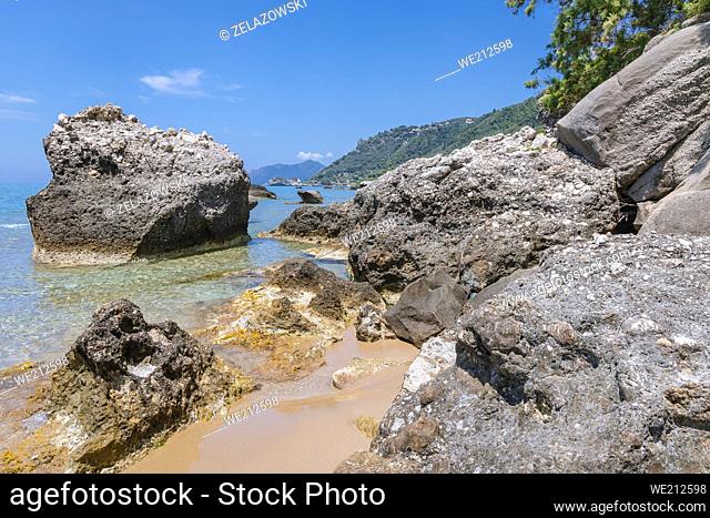 Rocks on a beach in Agios Gordios town on the coast of Ionian Sea on a Greek Island of Corfu