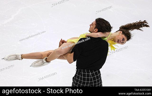 RUSSIA, UFA - OCTOBER 14, 2023: Ice dancers Sofia Kochushkina (top) and Mark Volkov perform in the ice dance rythm dance programme during Stage 1 of the...