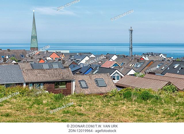 Aerial view roofs of village German island Helgoland with church tower and communication mast