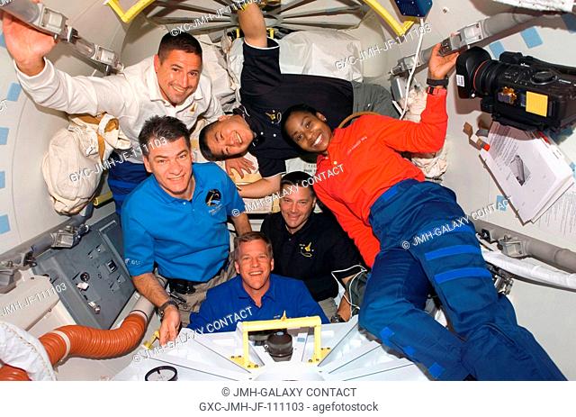 STS-120 crewmembers gather in the Orbiter Docking Compartment (ODS) after hatch opening between the International Space Station and Space Shuttle Discovery