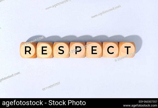 Respect word on wooden blocks isolated on gray background