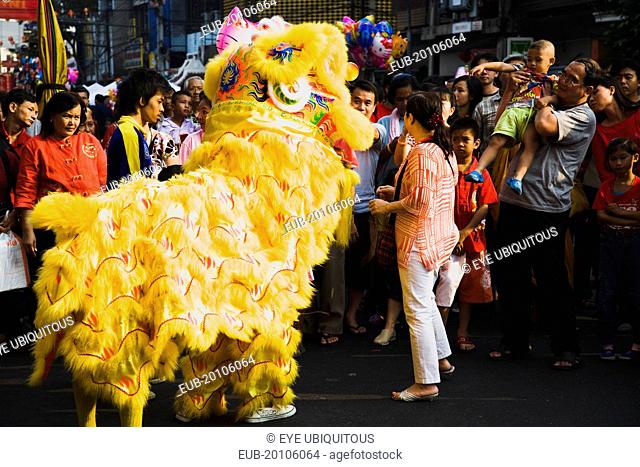 Yellow Dragon in dance troupe performance for Chinese New Year show