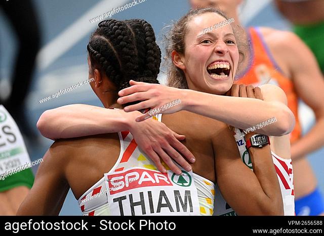 Belgian Nafissatou Nafi Thiam and Belgian Noor Vidts celebrate after the 800m race, the last of the five women pentathlon event