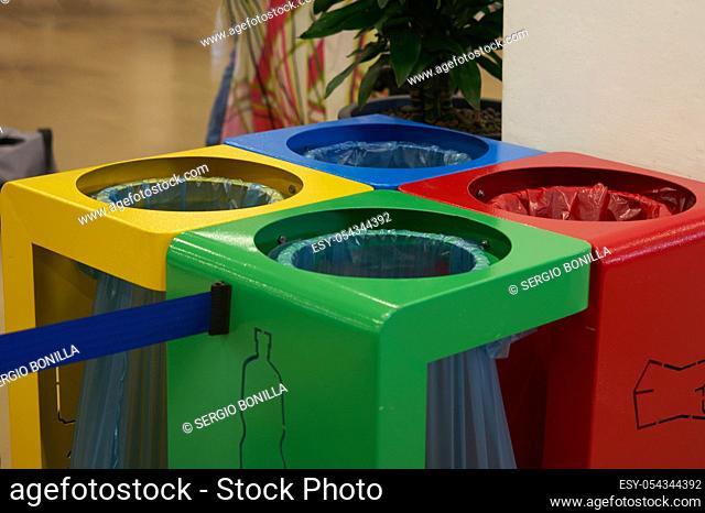 coloured waste containers to indicate the different types of recycling materials, depending on the type of waste and in yellow, blue, red and green