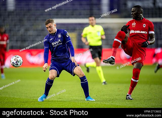 Anderlecht's Jacob Bruun Larsen and Antwerp's Abdoulaye Seck fight for the ball during a soccer match between RSC Anderlecht and Royal Antwerp FC