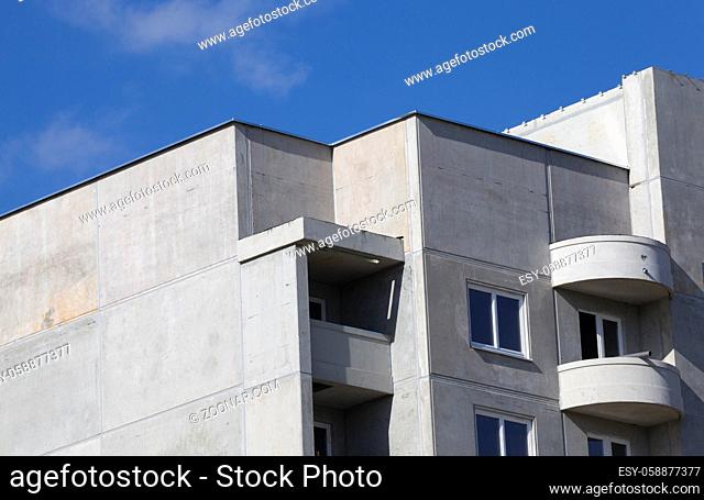 unfinished from large reinforced concrete slabs multi-storey residential house for people, photo from the construction site