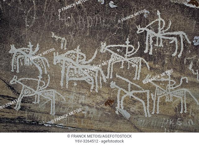Petroglyphs degraded by graffiti at Langar ( Wakhan valley, Tajikistan). They are representing horsemen