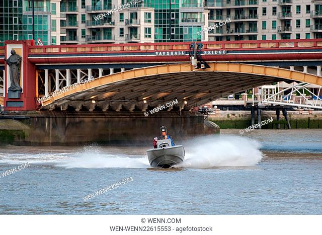 A military style boat in front of the MI6 building during filming of the new James Bond movie Spectre over the River Thames near London's MI6 Building in...