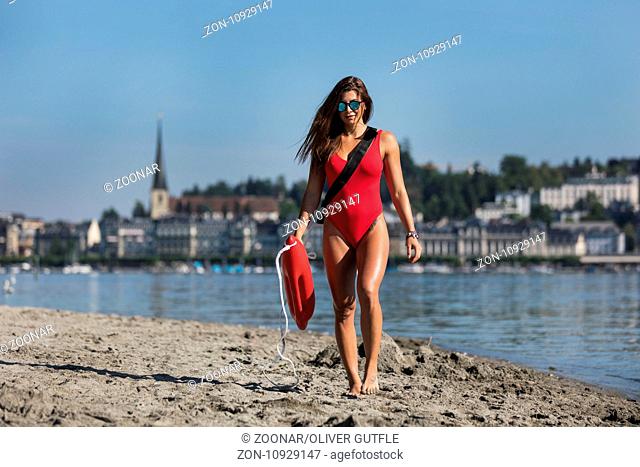 Young woman as a baywatch girl