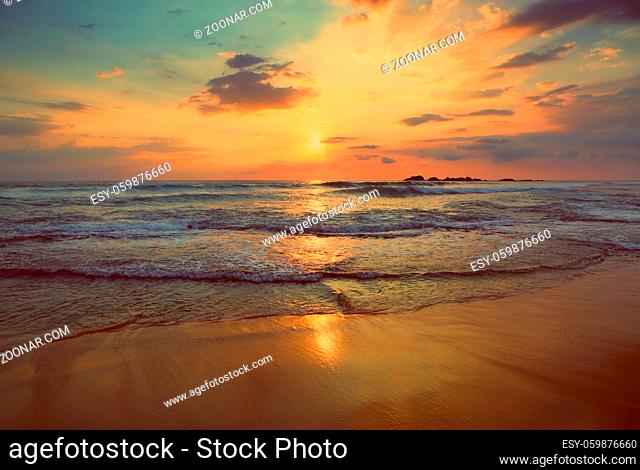 beautiful landscape with tropical sea sunset on the beach - vintage retro style