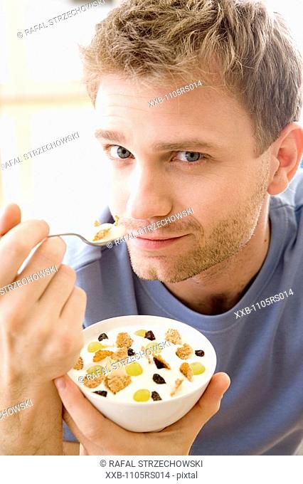 men eating breakfast cereals