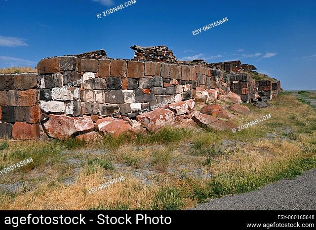 Ruined Fortress Erebuni walls made of tufa, Yerevan, Armenia on sunny summer day