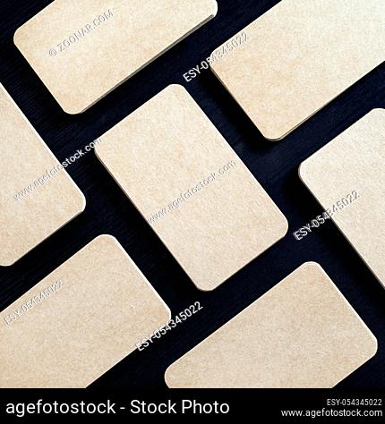 Many blank brown paper business cards. Corporate ID template. Flat lay