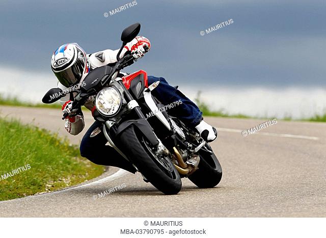 Motorcycle, MV Agusta Brutale 675 trepistoni, year of construction in 2012, curve picture, country road
