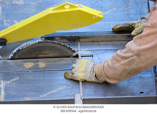 Worker fine-tuning a circular saw
