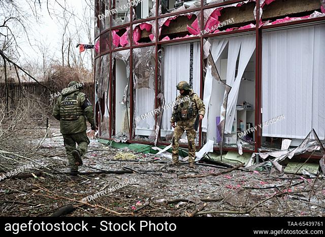 RUSSIA, DONETSK - DECEMBER 3, 2023: Officers of the Joint Centre for Control and Coordination of Issues Related to War Crimes of Ukraine (JCCC) inspect a beauty...