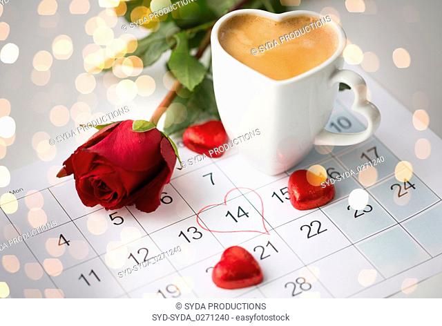 close up of calendar, hearts, coffee and red rose