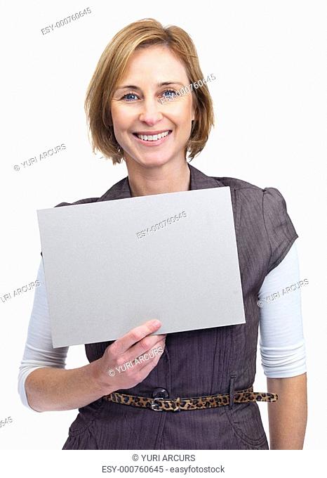 Portrait of an attractive lady holding a blank billboard isolated over white background