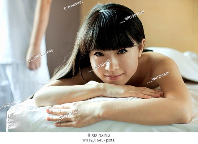Young Woman Relaxing on Massage Table