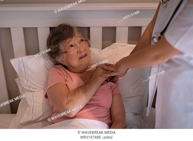 Physiotherapist consoling a senior woman