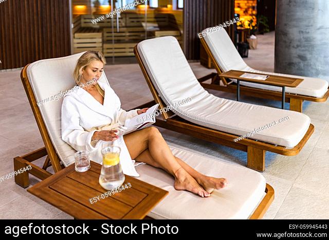 Beautiful woman relaxing in a beauty spa hotel - Client having a beauty treatment in a beauty spa salon