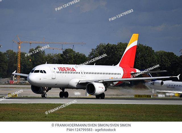 Airbus A320 Iberia Cadaques EC-LRG, at the start, runway, takes off, takes off. Franz Josef Strauss Airport in Munich.Munich. | usage worldwide