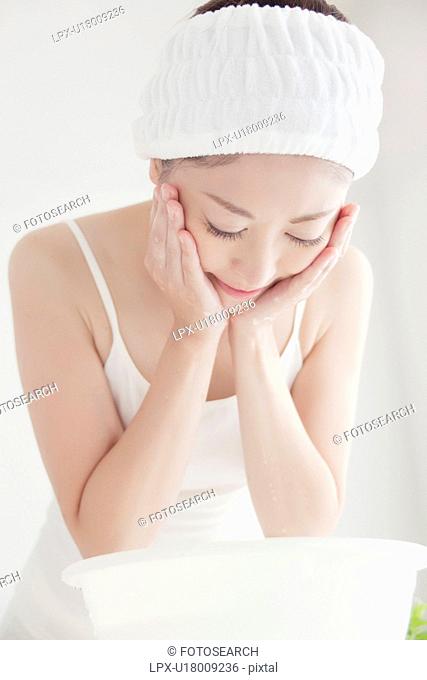 Young Woman Washing Face