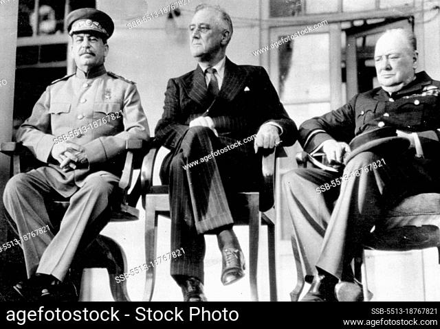 Principals At Teheran Conference -- Joseph Stalin, Russian premier (left), sits with President Franklin D. Roosevelt of the United States and Prime Minister...