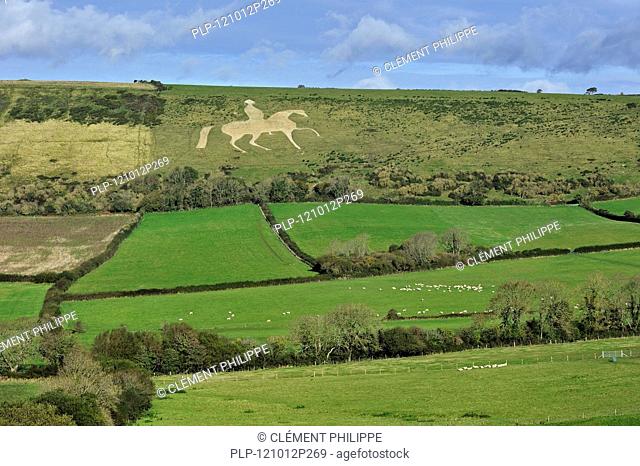 The Osmington White Horse, hill figure of George III on horseback sculpted in 1808 into the limestone Osmington hill along the Jurassic Coast, Dorset