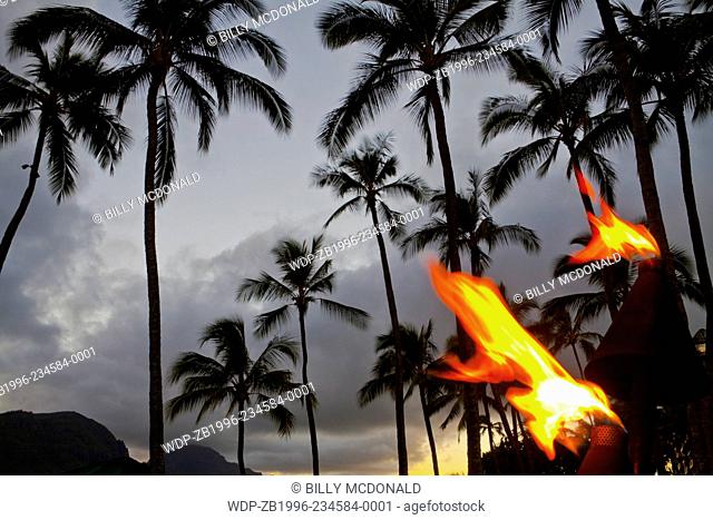 Tiki Torches at Sunset on Kalapaki Beach, Lihue, Kauai, Hawaii, USA