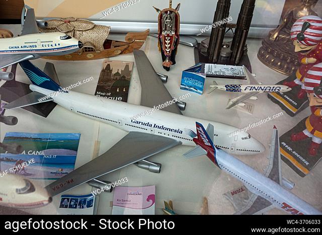 Helsinki, Finland, Europe - Scale model airplanes and souvenirs inside a shop window of a small travel agency in the centre of the Finnish capital city