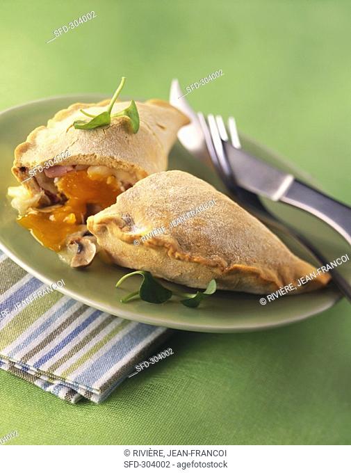Calzone filled with egg, ham and mushrooms